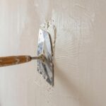 apply plaster to interior walls